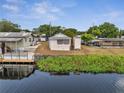 Single-story home on the water with a nice dock and lake view at 1626 Salmon St, St Cloud, FL 34771