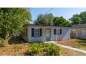 Charming single-story home featuring well-maintained landscaping and black shutters for added appeal at 1814 Leroy Dr, Haines City, FL 33844