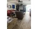 Cozy living room with comfortable seating and a sliding glass door at 225 Ronnie Cir, Orlando, FL 32811