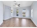 Bright living room featuring wood floors, and multiple windows at 2401 8Th St, St Cloud, FL 34769