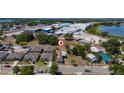 An aerial view of a neighborhood featuring single-Gathering homes close to businesses and roadways at 31 Cedar St, Haines City, FL 33844