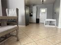 Dining room showcasing tile floors, and a crib at 311 Congress Ave, Auburndale, FL 33823