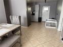 Dining room showcasing tile floors, and a crib at 311 Congress Ave, Auburndale, FL 33823