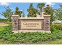 The Grandview Gardens brick community sign is surrounded by green landscaping at 331 Alexandrite St, Deland, FL 32720