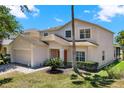 Charming two-story home featuring a well-maintained lawn and inviting curb appeal on a sunny day at 4739 Cumbrian Lakes Dr, Kissimmee, FL 34746