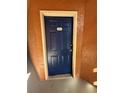 A secure blue front door with a digital lock and visible unit number 1426 at 5160 Conroy Rd # 26, Orlando, FL 32811