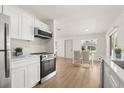 Bright, updated kitchen with stainless steel appliances and an adjacent dining area with natural light at 620 Plum Ln, Altamonte Springs, FL 32701