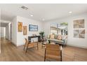 Inviting living room featuring natural light, hardwood floors, stylish decor, and neutral tones at 620 Plum Ln, Altamonte Springs, FL 32701