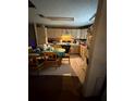 Functional kitchen with a breakfast table, light wood cabinets, and ample counter space for cooking at 716 Grove Ave, Orlando, FL 32805