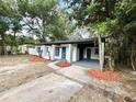 Inviting home with a covered entrance and a spacious driveway at 906 San Domingo Rd, Orlando, FL 32808