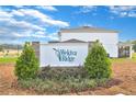 Wekiva Ridge community sign showcasing lush landscaping and an inviting entrance at 1058 Cloud Ridge Ct, Mount Dora, FL 32757