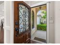Elegant entryway features a decorative front door and a welcoming view into the home at 1116 Oak Pond Dr, Celebration, FL 34747