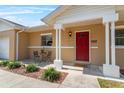 Close-up of the entrance showcasing a brick facade and cozy front porch with seating at 3122 Eleuthera Ln, Orlando, FL 32827