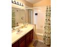 Functional bathroom with a combined shower and tub, complemented by a vanity and ample lighting at 314 Saddle Ridge Dr, Davenport, FL 33896