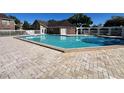 Sparkling community pool with lounge area and clubhouse nearby at 4301 Lizshire Ln # 306, Orlando, FL 32822