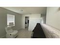 Bright living room featuring tile floors and fresh white paint at 5624 Beggs Rd, St Cloud, FL 34771
