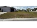 View of the front yard with green grass at 5624 Beggs Rd, St Cloud, FL 34771