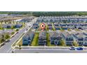 Aerial view of a home with an indicator in a well-planned community at 6452 Sprucepine Ln, St Cloud, FL 34771