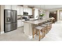 Spacious kitchen with an island, stainless steel appliances, and a breakfast bar at 730 Lake Dell Rd, Dundee, FL 33838
