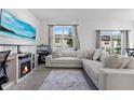 Comfortable living area features a large sectional sofa, modern decor, and a serene, inviting ambiance at 740 Madison Dr, Davenport, FL 33837