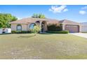 Charming one-story home with meticulously maintained front lawn and landscaping at 7431 Sw 129Th Pl, Ocala, FL 34473