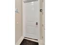 Close-up of the front door with a door number sign on the wall and a keypad lock on the door at 7740 Sandy Ridge Dr # 236, Reunion, FL 34747