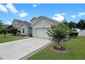 Attractive house with a well-kept lawn, driveway, and landscaping adds to its curb appeal at 8439 Adele Rd, Lakeland, FL 33810