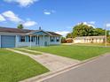 Single-story home with a well-kept lawn and a driveway at 98 Pinata Ct, Kissimmee, FL 34743