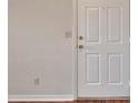 Neutral entryway with a white door and wood flooring, ready for personal touches at 1065 S Hiawassee Rd # 1425, Orlando, FL 32835