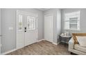 Inviting entryway with tiled floors, decorative glass front door, and a coat closet at 2281 Canyon Breeze Ave, Kissimmee, FL 34746