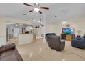 Spacious living area featuring an open floorplan, neutral paint, and tile floors at 2398 Queenswood Cir, Kissimmee, FL 34743