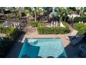 Refreshing pool area with comfortable lounge chairs and beautiful landscaping at 2938 Salted Rim Rd, Kissimmee, FL 34747