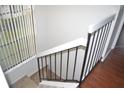 Carpeted staircase with white risers and black metal railing at 3214 Rio Grande Trl # 1, Kissimmee, FL 34741