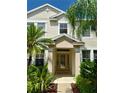 Elegant front entrance with a decorative glass door and tasteful landscaping at 3341 Pawleys N Loop, St Cloud, FL 34769