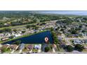 Aerial view of property with lake view in a serene community setting. Located close to many amenities at 3928 Blackberry Cir, St Cloud, FL 34769