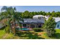 Screened pool and lanai overlooking lush backyard, perfect for outdoor entertaining at 3928 Blackberry Cir, St Cloud, FL 34769