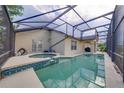 The backyard features a screened-in pool and spa for ultimate relaxation at 3928 Blackberry Cir, St Cloud, FL 34769