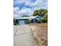 Inviting single-story home with a convenient garage and neatly kept lawn at 8704 Tom Costine Rd, Lakeland, FL 33809
