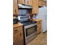 Functional kitchen with stainless steel appliances and ample cabinet space at 8704 Tom Costine Rd, Lakeland, FL 33809