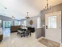 Spacious floor plan showcases the dining area and living room with tile floors throughout at 112 Grand Canal Dr, Poinciana, FL 34759