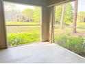 Screened in porch overlooking pond and lush greenery providing a serene outdoor space at 2213 Metropolitan Way # 1318, Orlando, FL 32839
