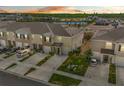 An aerial view shows the townhome's proximity to a tranquil pond, providing a serene backdrop at 2302 Tay Wes Dr, St Cloud, FL 34771