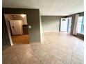 Inviting living room with tiled floor, and neutral paint at 31 S Edgemon Ave, Winter Springs, FL 32708