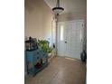 Welcoming foyer featuring tile flooring and stylish decor at 585 Mourning Dove Cir, Lake Mary, FL 32746