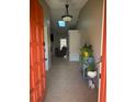 Bright foyer with tile flooring, skylight, and view into living space at 585 Mourning Dove Cir, Lake Mary, FL 32746