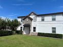 Well-maintained two-story home with manicured lawn and stone detailing, providing a pleasant exterior view at 9938 Eagle Creek Center Blvd, Orlando, FL 32832