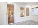 Sunroom with detailed tile floor, access to the main house, and lots of windows at 1007 11Th St, St Cloud, FL 34769