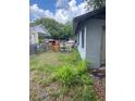 Backyard of property with lush vegetation and a chain link fence at 2071 Liston Ct, Orlando, FL 32811