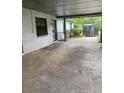 Carport view, showing the driveway, access to the home and an outdoor storage shed at 2071 Liston Ct, Orlando, FL 32811