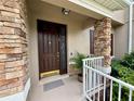 Inviting front entrance with a solid door, stylish hardware, and a secure smart lock at 2287 Park Maitland Ct, Maitland, FL 32751